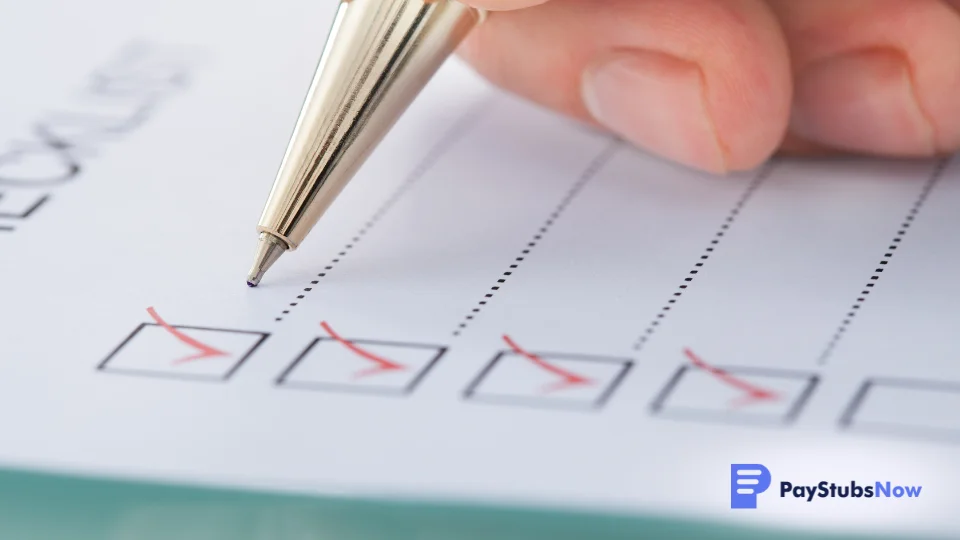 A person checks off items on an employee offboarding checklist