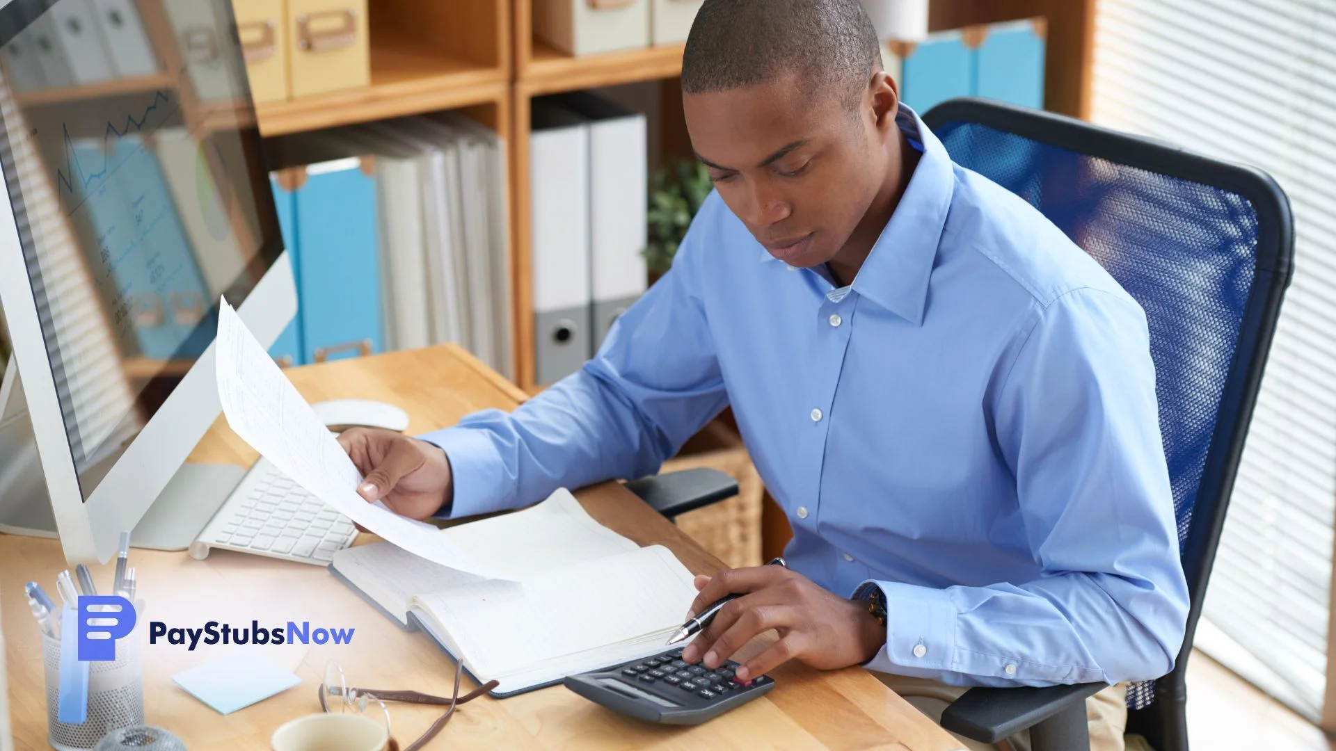 An independent contractor reviews financial papers with a laptop and calculator.