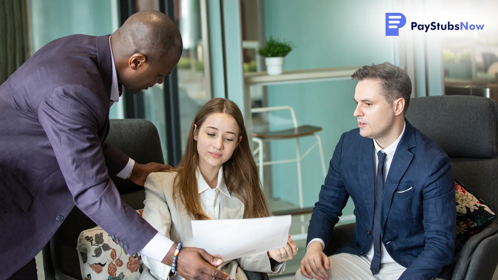 A business team reviewing a document together to discuss deadlines, filing steps, and state requirements for taxes.