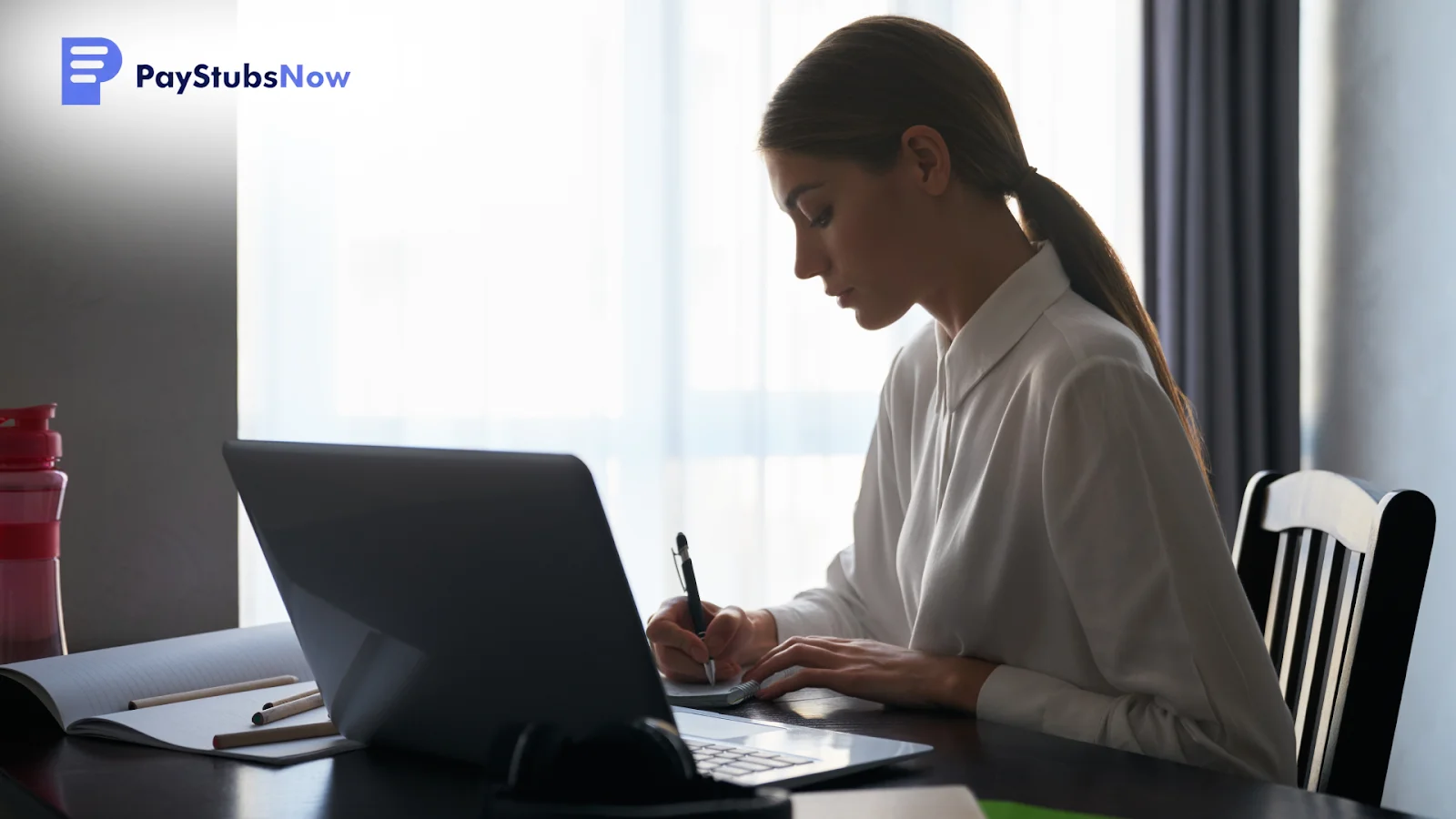 A woman taking notes at her desk, 1099-NEC Instructions for Filing.
