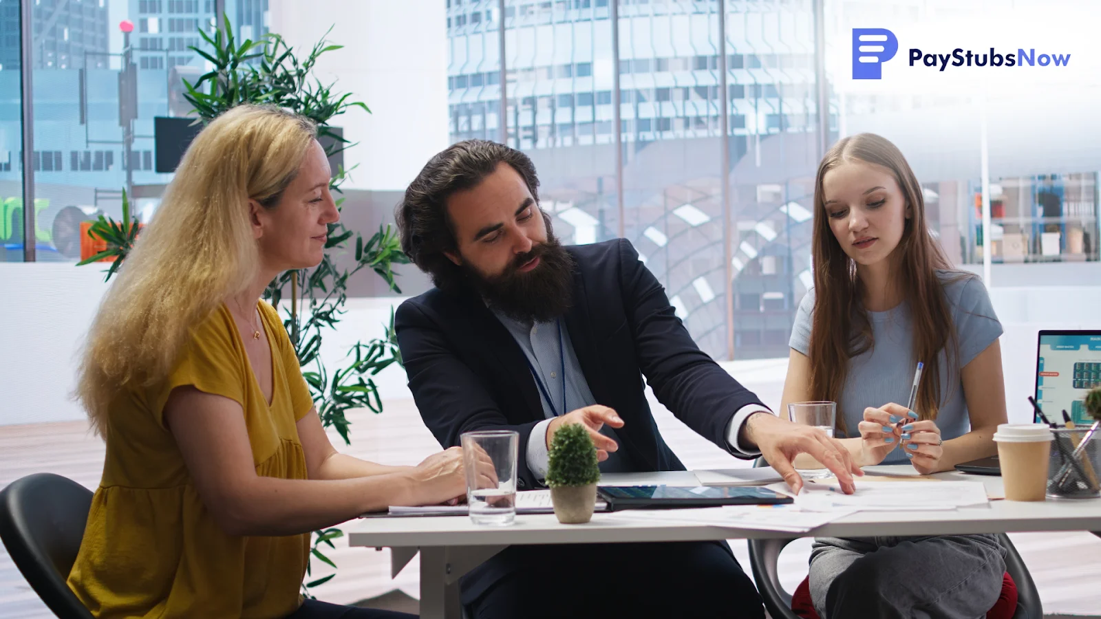 A group of people sitting at a table reviewing paperwork to identify the key differences between an invoice and a receipt.
